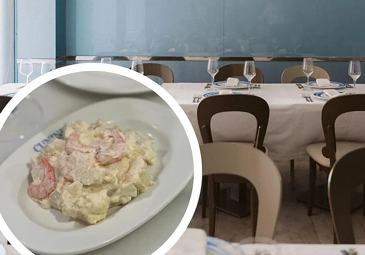 Deliciosa ensaladilla de gambas cremosa, servida en un plato blanco, lista para disfrutar en un restaurante con mesas puestas.